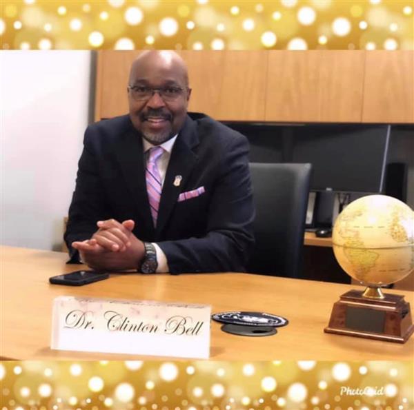 Dr. Clinton Bell at his desk in the School No. 22 principal's suite. 
