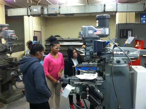 Marjorie, Naisha hard at work with  Jennell waiting her turn 